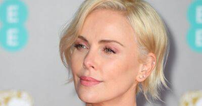 Charlize Theron ditches her trademark blonde hair for a daring black mullet - www.ok.co.uk - Ukraine