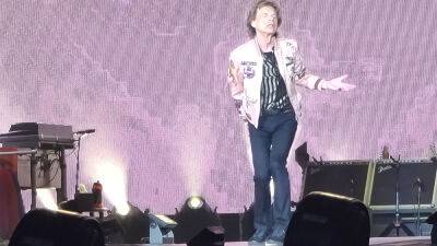Mick Jagger Has Covid, Is Experiencing Symptoms As Rolling Stones Postpone At Least One Show On European Tour - deadline.com - Italy - Switzerland - city Amsterdam