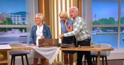 Holly Willoughby - Phillip Schofield - Sarah Greene - This Morning hosts speechless as Blue Peter time capsule is opened and all contents ruined - ok.co.uk