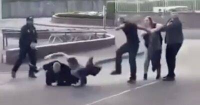 Scots supermarket brawl sees woman knocked to ground as men punch and kick each other in street - dailyrecord.co.uk - Scotland