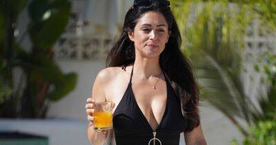 Casey Batchelor oozes confidence as she steps out in plunging swimsuit in Ibiza - www.ok.co.uk