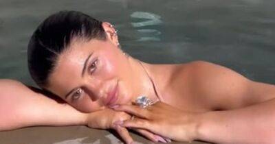 Kylie Jenner urges fans to 'free the nipple' as she poses in nude effect bikini - www.ok.co.uk - Utah - Lake - county Powell