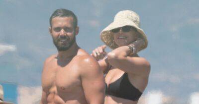 Vogue Williams and Spencer Matthews flaunt their rippling abs in swimwear as they enjoy beach day - www.ok.co.uk - Spain - Ireland - Chelsea