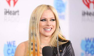 Avril Lavigne ditches her trademark stage look for new Versace jacket - hellomagazine.com