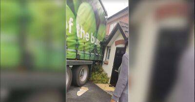 Huge Asda lorry crashes into two homes 'while trying to reverse out of cul-de-sac' - www.manchestereveningnews.co.uk - Manchester