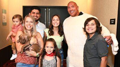 Dwayne Johnson Gives Puppy to New Family During 'DC League of Super-Pets' Screening - www.etonline.com