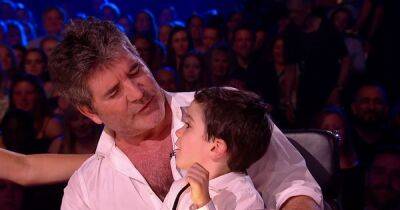 Eric's got talent as Simon Cowell's son takes on handstand challenge with mum Lauren - www.ok.co.uk - Britain