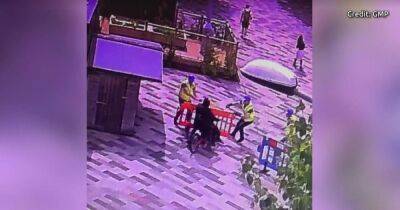 Moment police officers disguised as builders arrest men at university campus - manchestereveningnews.co.uk - Manchester