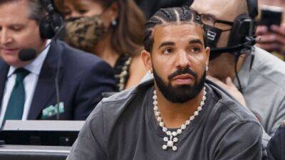 Drake - Drake Roasts His Father Dennis Graham For Getting a Massive Tattoo of His Face - etonline.com - county Graham
