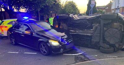 Car overturns in dramatic smash before cops stop TWO drivers filming scene on their phones - manchestereveningnews.co.uk - Manchester