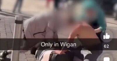 Tiktok - "Only in Wigan": Pie shop worker splits up town centre fight in dramatic TikTok video - manchestereveningnews.co.uk - Manchester - city Wigan
