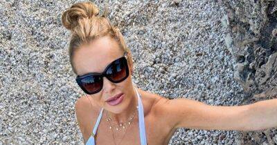 Amanda Holden, 51, looks decades younger as she poses in holiday bikini - www.ok.co.uk - Britain - Italy