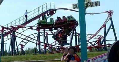 "I couldn't believe they were still stuck there": Horror after rollercoaster suddenly stops - leaving families hanging 'for 90 minutes' - www.manchestereveningnews.co.uk - Manchester