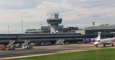 Emergency services called to Manchester Airport after baggage truck crashes - www.manchestereveningnews.co.uk - Manchester