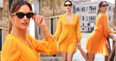 Alessandra Ambrosio wows in a vibrant orange mini dress in Venice - www.msn.com - Brazil - Italy - city Venice