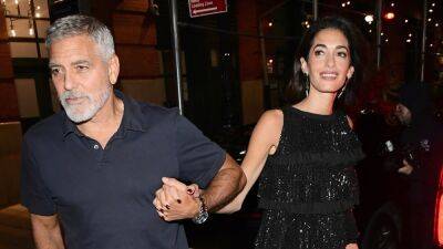George Clooney - Julia Roberts - Amal Clooney - George and Amal Clooney Hold Hands During Date Night in New York City - etonline.com - Britain - Los Angeles - New York
