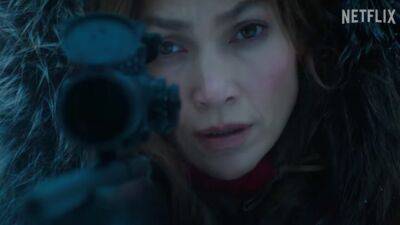 Jennifer Lopez - Liam Neeson - Joseph Fiennes - Paul Raci - Watch Jennifer Lopez Do Pull-Ups in the Snow in Gritty Assassin Movie Trailer - glamour.com - Netflix