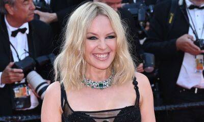 Kylie Minogue - Kylie Minogue sizzles in striking silver dress to announce exciting news - hellomagazine.com - Britain