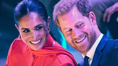Meghan Markle - duke Harry - Meghan Markle Makes Bold Return to the U.K. in a Fire Red Suit - glamour.com - Britain - Germany - county Summit - city Manchester, county Summit