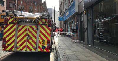 Firefighters battle blaze at three-storey building in city centre - www.manchestereveningnews.co.uk - Manchester