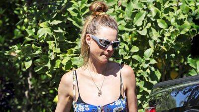 Behati Prinsloo Shows Off Baby Bump in Floral Dress While at Lunch With Adam Levine - www.etonline.com - Los Angeles