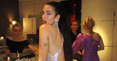 Dua Lipa Flashes Her Thong in a Completely Backless Dress While Celebrating New Year’s Eve - www.usmagazine.com