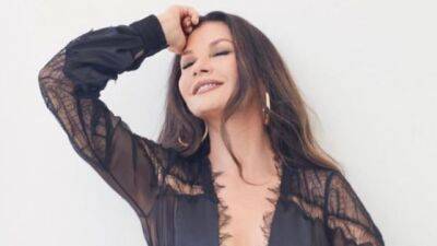 Catherine Zeta-Jones Went Full Morticia Addams in a Sheer Cutout Jumpsuit—See Pics - www.glamour.com