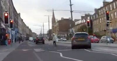 Shocking video shows car almost hitting elderly woman after 'ignoring' red light - www.dailyrecord.co.uk - Scotland - Beyond