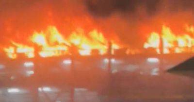 Huge fire engulfs Luton airport car park as flights suspended with people asked to avoid the area - www.manchestereveningnews.co.uk - Britain - Manchester - Israel