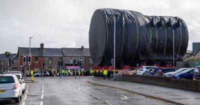 Royal Navy's new nuclear sub is driven through town in 'world's largest black bin bag' - www.manchestereveningnews.co.uk - county Hall - county Barrow
