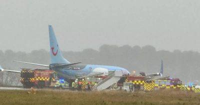 TUI plane skids off runway in terrifying landing during Storm Babet - www.dailyrecord.co.uk
