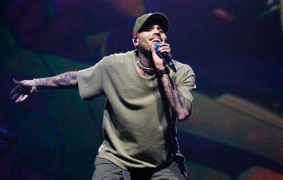 Chris Brown sued for beating man with bottle in London club - www.nme.com - London
