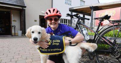 Paw-some Helen will cycle from Cairo to Cape Town to raise cash for Guide Dogs - www.dailyrecord.co.uk - Scotland - Botswana - Egypt - city Cape Town - county Falls - Tanzania - city Cairo - city Livingston