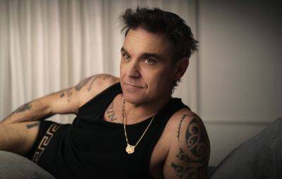 Robbie Williams explains why he didn’t consult with Gary Barlow about Netflix doc - www.nme.com