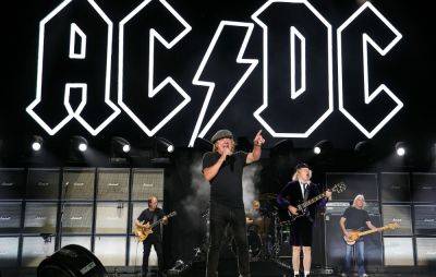 AC/DC fans launch Christmas Number One campaign to thwart LadBaby - www.nme.com - Britain