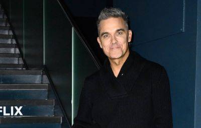 Robbie Williams fan in serious condition after fall during concert - www.nme.com - Australia - county Moore - county Williams