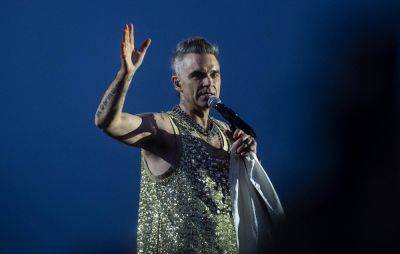 Robbie Williams pays tribute and dedicates ‘Angels’ to fan who died after Sydney concert - www.nme.com