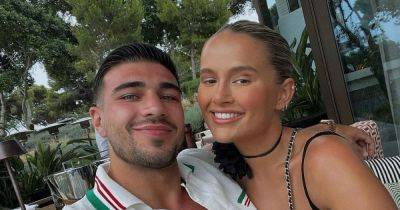 Tommy Fury dotes on Bambi as he returns to UK from Dubai - after Molly-Mae removed engagement ring - www.ok.co.uk - Britain - city Abu Dhabi - Manchester - Hague - Uae