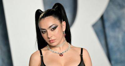 Charli XCX engaged to The 1975's drummer George Daniel as she shows off diamond ring - www.ok.co.uk - county Love