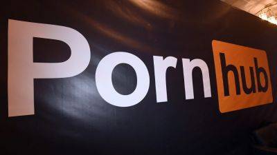 Pornhub Parent Company Admits to Profiting From Sex Trafficking, Will Pay $1.84 Million Fine and Compensate Victims - variety.com - New York - California - Canada