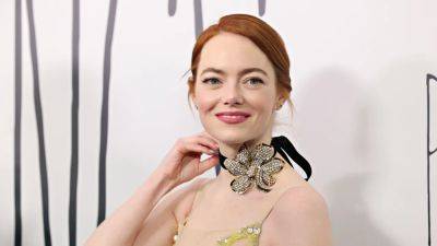 Emma Stone's Take on the Ribbon Choker Trend Involves a Lot of Bling - www.glamour.com - France - New York