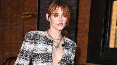 Kristen Stewart Debuts Ginger Bangs in an Ultra-Feminine Dress and Some Very Punk Boots - www.glamour.com - Manchester