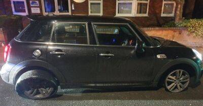 Woman arrested after police spot Mini being driven with tyre 'just about hanging on' - www.manchestereveningnews.co.uk - Manchester - county Hale