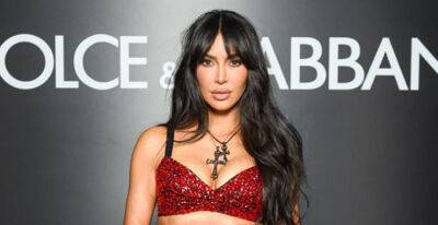 Kim Kardashian Sizzles in Red Bedazzled Crop Top & Matching Skirt for Dolce & Gabbana Show in Milan - www.justjared.com - Italy