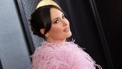 Kacey Musgraves Looks Like a Barbiecore Snack in a Skin-Tight Bodysuit and Feathered Cape—See Pics - www.glamour.com