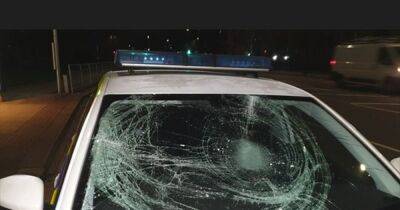 Anger as 'mindless' vandal smashes police car windscreen as officers help pensioner injured in fall - www.manchestereveningnews.co.uk - Manchester