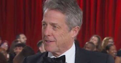 Hugh Grant slammed for excruciating Oscars red carpet chat: 'Worst interview ever' - www.ok.co.uk - Britain