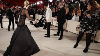 Lady Gaga Rushes to Help Photographer Who Fell on 2023 Oscars Red Carpet - www.etonline.com - France - Hollywood