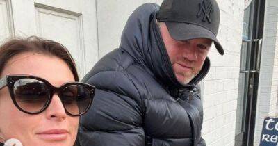 Coleen Rooney confuses fans with loved-up Wayne snaps on 'Corrie set' as couple continue to live apart - www.manchestereveningnews.co.uk - Britain - Manchester