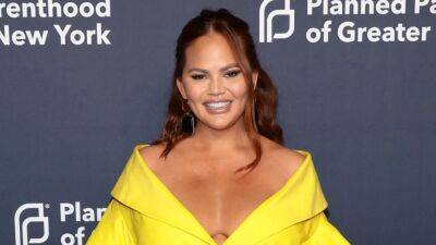 Chrissy Teigen Says Luna and Miles 'Adore' Baby Esti and 'Fight' Over Who Gets to Push Her in the Stroller - www.etonline.com
